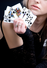 sexy woman holding playing cards