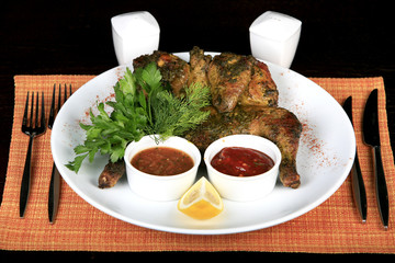 Roasted whole chicken on a plate