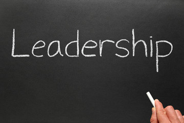 Writing leadership on a blackboard.