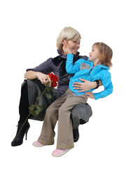 Little daughter hugs the young mother on a white background