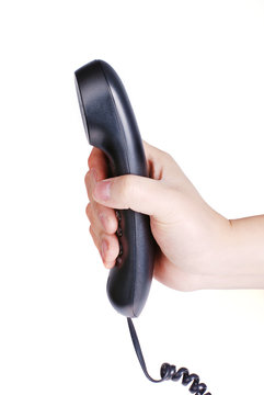 black telephone receiver in hand