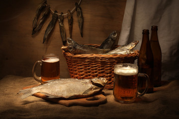 Beer still life with fishes and bottles