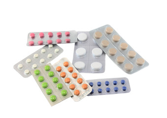 Coloured pills on white background. Top view. Isolated