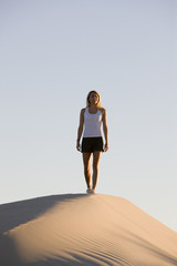 Woman Hiking on Sand Dune