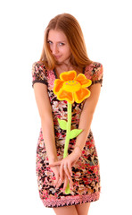 Young woman posing with toy flower isolated on white