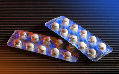Packaging of pills in blue and orange