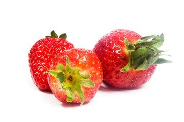 3 strawberries on a white background