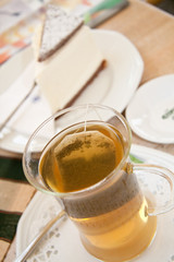 Cup of green tea and piece of cake