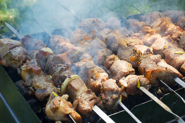 Pork meat slices on fire in foam