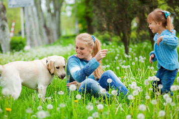 Woman with girl and dog