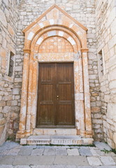 Fototapeta na wymiar Old chatedral wooden door