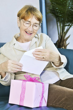 Old Woman Opening Present