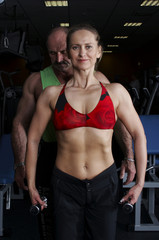 Fototapeta na wymiar two bodybuilders in gym