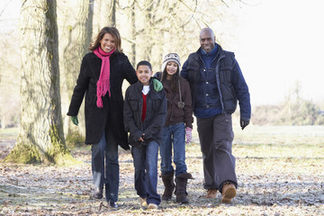 Family On Autumn Walk In Countryside