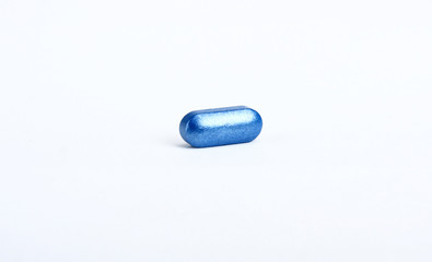 An isolated blue capsule on white background