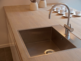 Details of modern kitchen sink with tap faucet