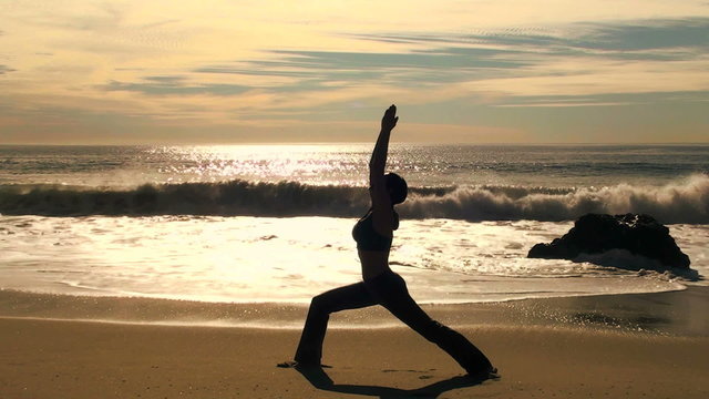 Yoga triangle pose at sunset - HD