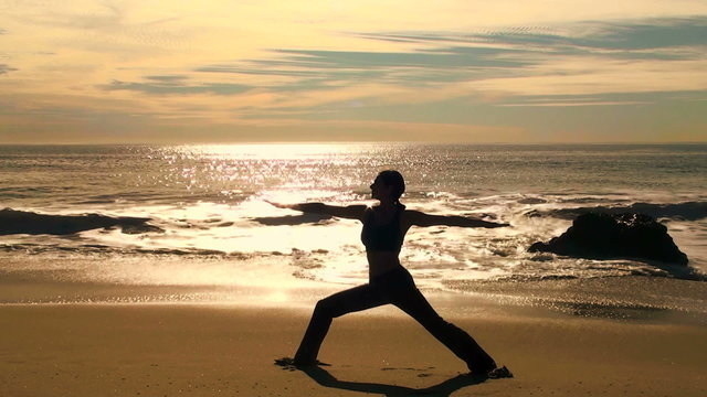 Yoga reverse warrior at sunset - HD