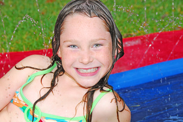 Happy girl in water play