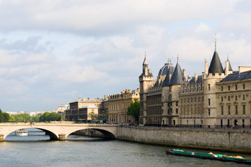 Cite island view with Conciergerie and bridge Change. Paris