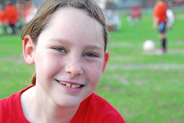 Young soccer player on field