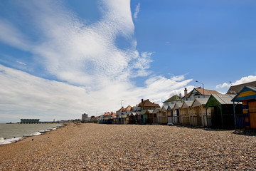 Pebble beach with a row of small huts