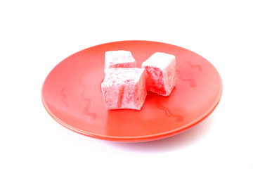Turkish delight (lokum) confection on a white dessert plate