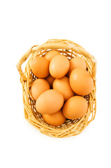 Basket full of eggs isolated on white