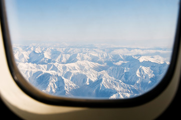 Obraz premium Winter mountains from the plane window