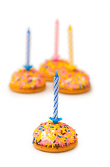 Cup cakes and candle isolated on the white background