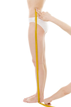 Measuring woman's leg length