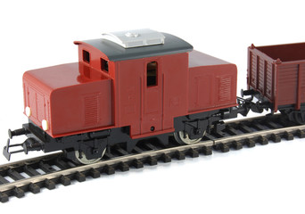 Toy Diesel Locomotive and freight wagon on white background