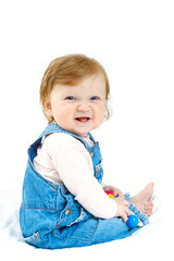 child at jeans suit with toy