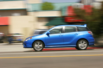 Fototapeta na wymiar Motion Blur Blue Car