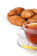 Fresh croissant and cup of tea