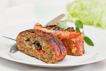 sliced fillet meat - stuffed black olives and mushrooms