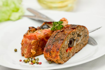 sliced fillet meat - stuffed black olives and mushrooms