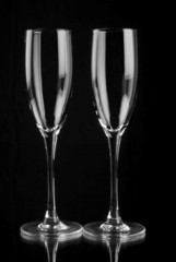 Champagne flutes reflecting in mirror