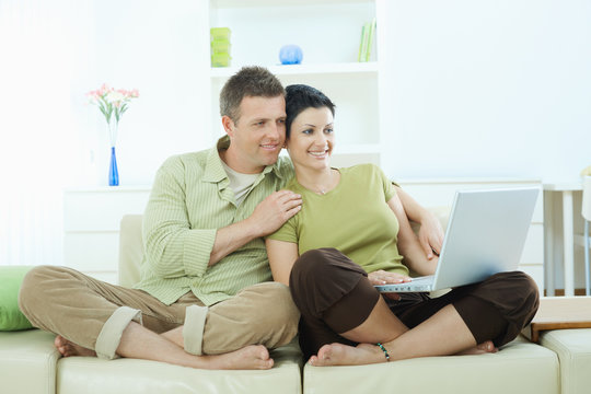 Couple browsing internet at home