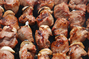 Preparation of meat on fire