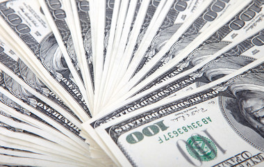One hundred dollars pile as background