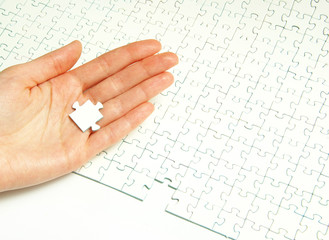 hands holding  puzzle