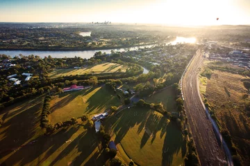 Gordijnen Sunshine over early morning in Brisbane from air © Martin Valigursky