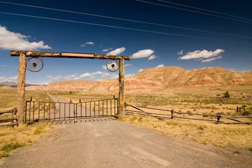 Tuinposter A gate and a fence in desert, wild west © Evgeny Dubinchuk