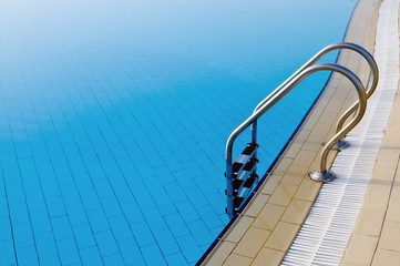 Swimming pool with ladder