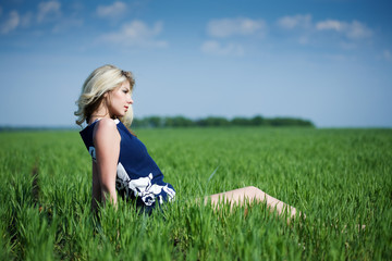 Fototapeta premium Beautiful young woman in the field