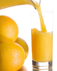 Oranges with fresh juice on white background
