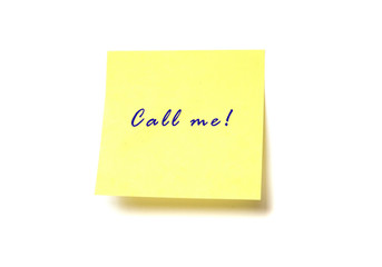 Yellow post it with words "Call me!" isolated on white