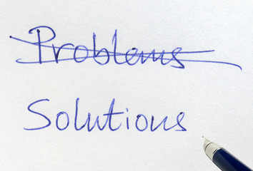 Crossing out problems and writing solutions.