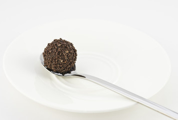 Chocolate truffle on a silver spoon II